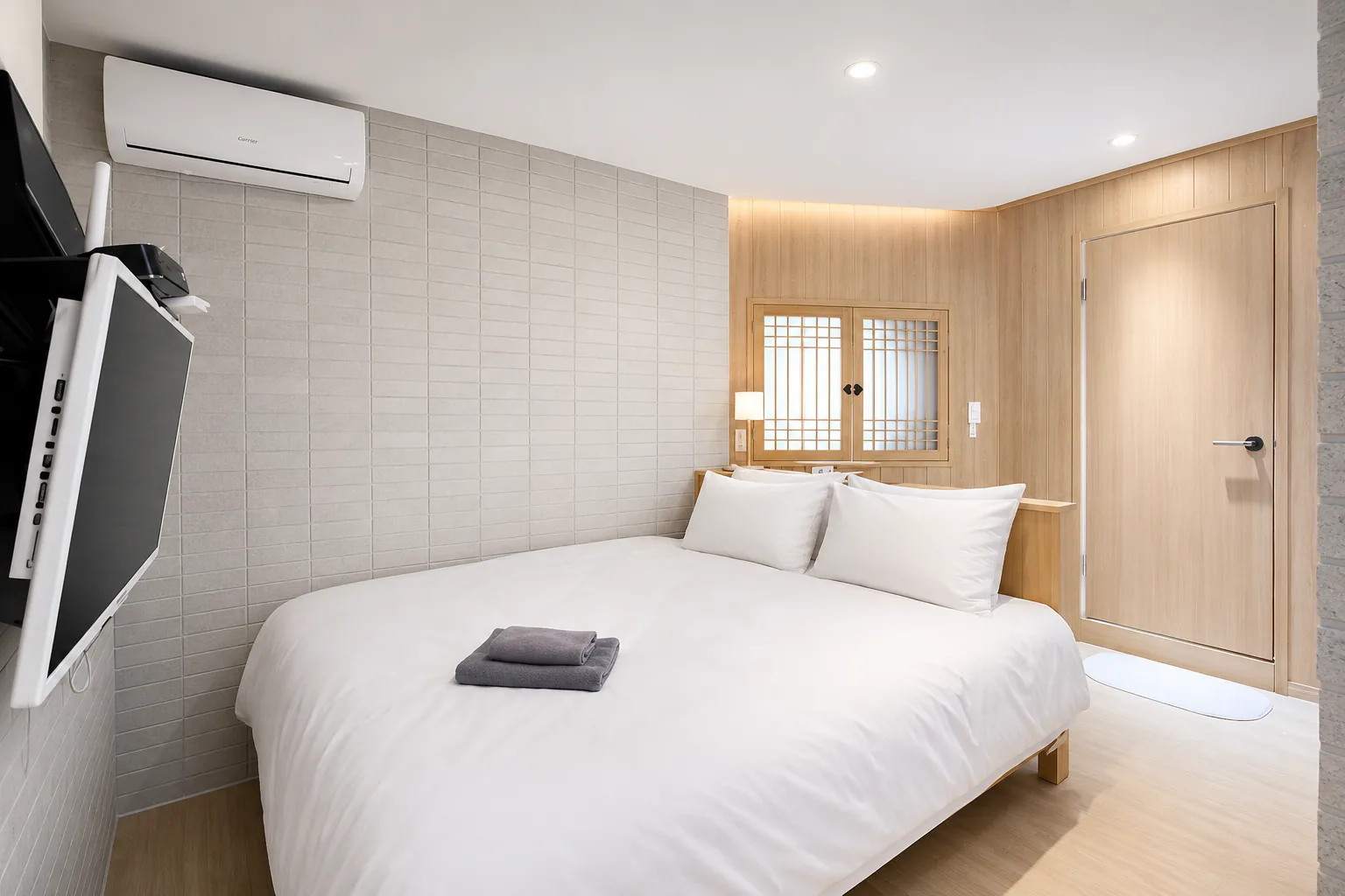 Bedroom with wood-panelled wall