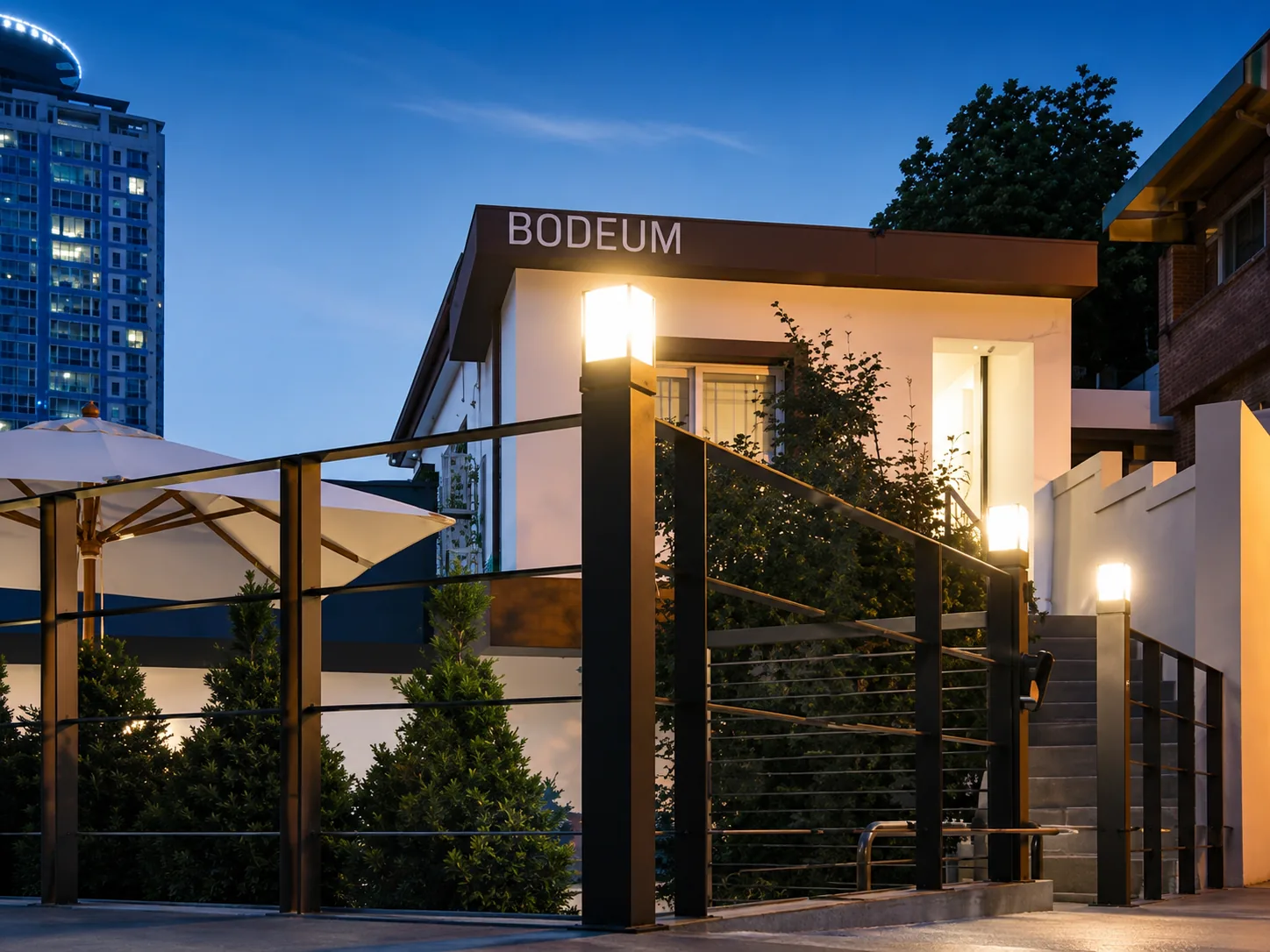 Bodeum Stay entrance sign at dusk